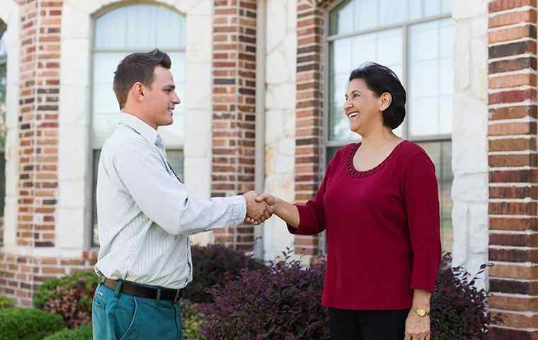tech greeting a homeowner for follow up appointment