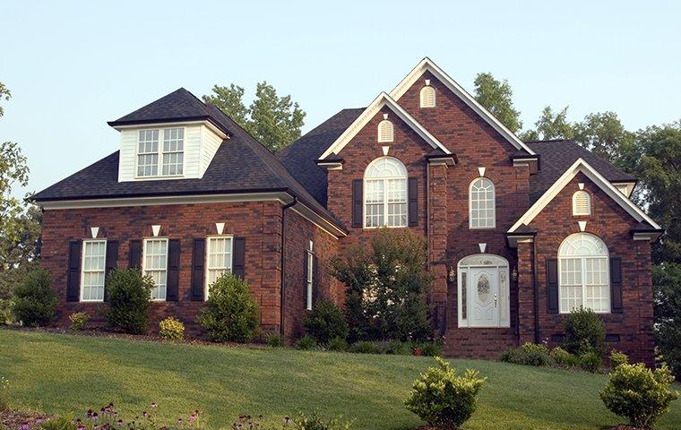 street view of large brick home