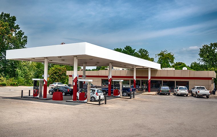 a memphis gas station parking lot with gas pumps 